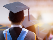 back of head person wearing graduation